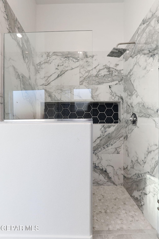 room details with a marble finish shower