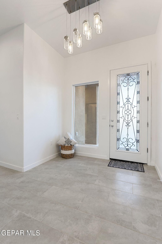 foyer entrance with baseboards