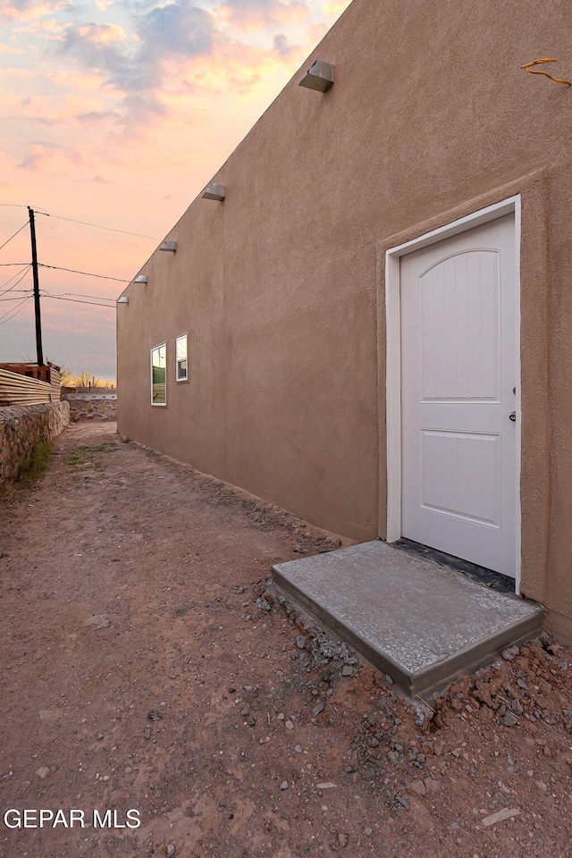 view of property exterior with stucco siding