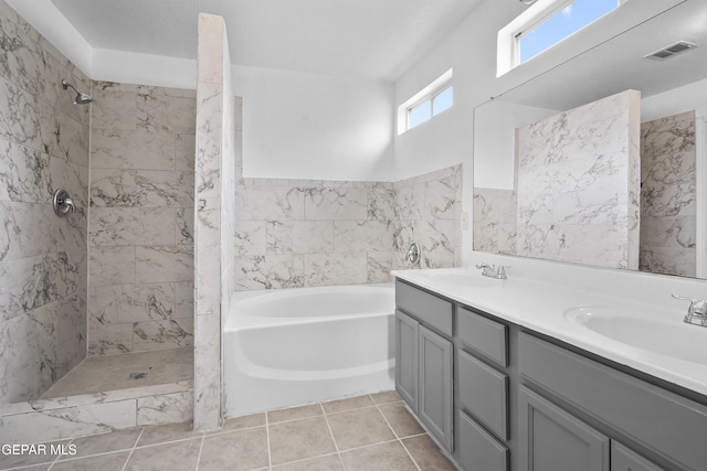 bathroom with plus walk in shower and vanity