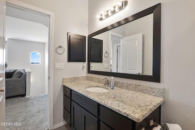 bathroom featuring vanity and baseboards