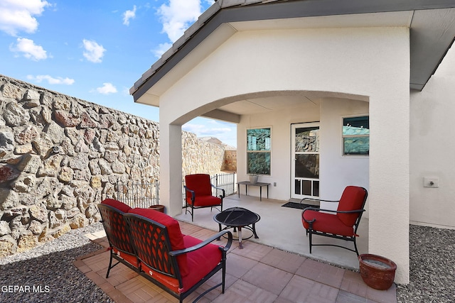 view of patio featuring a fire pit