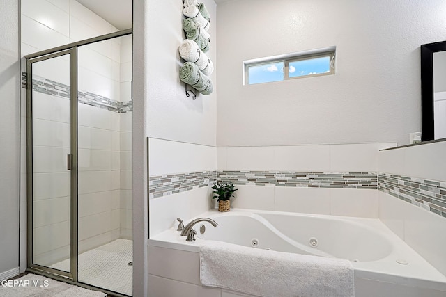 bathroom with separate shower and tub