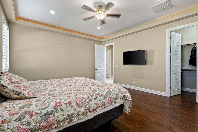 bedroom featuring ceiling fan and dark hardwood / wood-style flooring