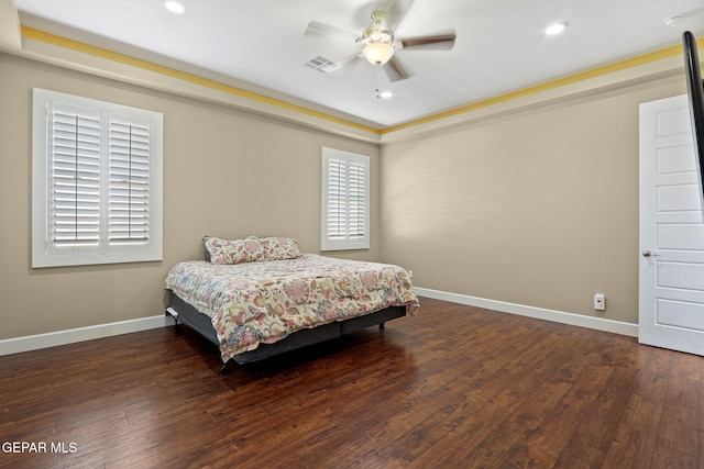 bedroom featuring dark hardwood / wood-style floors and ceiling fan