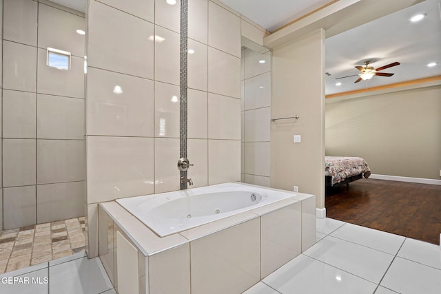 bathroom with tile walls, tile patterned floors, independent shower and bath, and ceiling fan