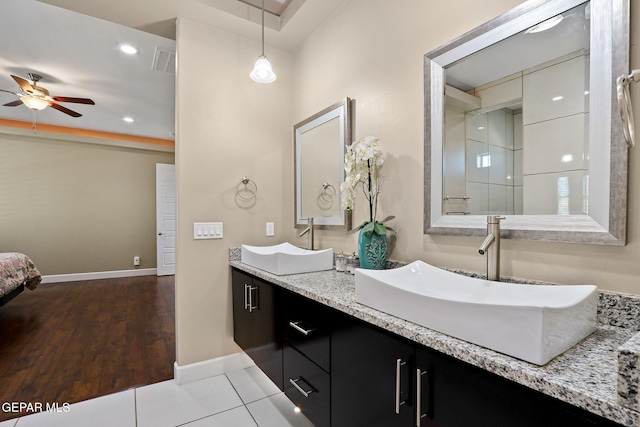 bathroom featuring ceiling fan, vanity, and tile patterned flooring