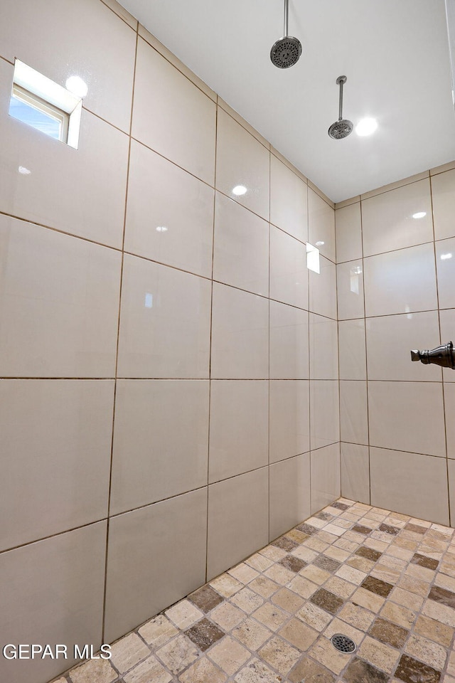 bathroom with a tile shower