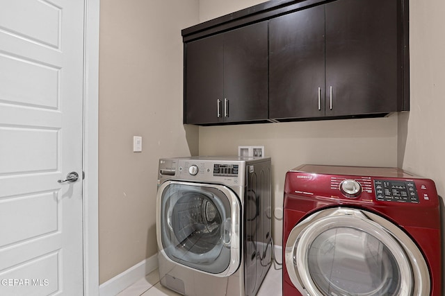 washroom with cabinets and separate washer and dryer