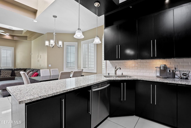 kitchen with light tile patterned floors, sink, dishwasher, hanging light fixtures, and decorative backsplash