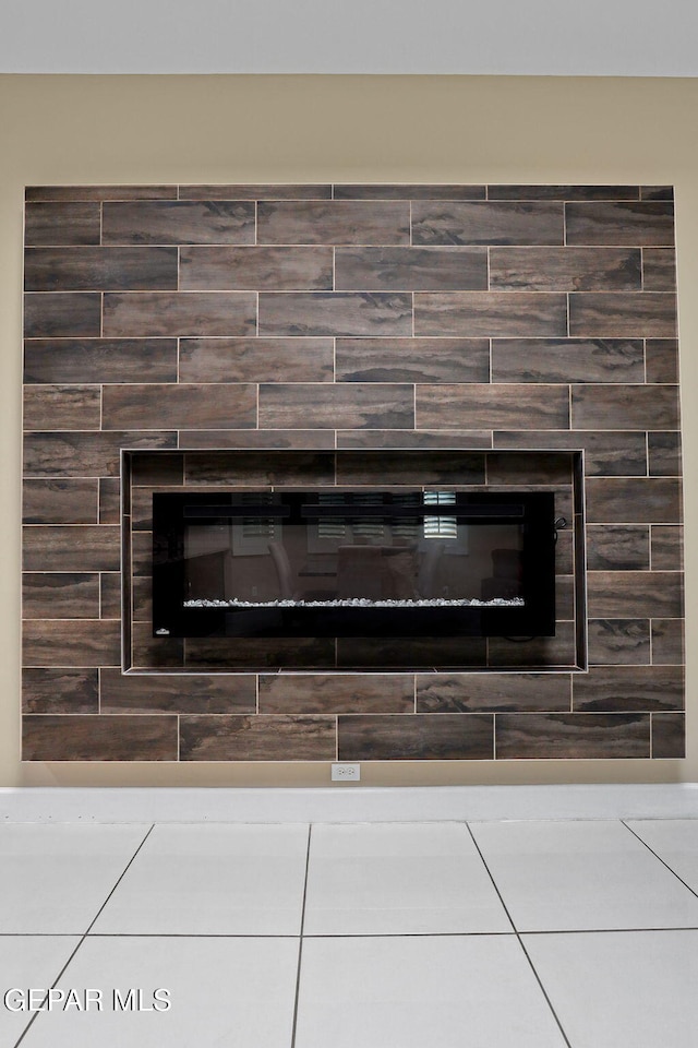 details with a tile fireplace