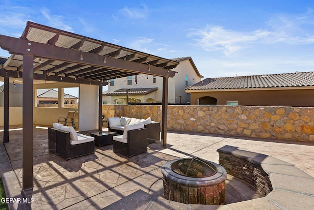 view of patio / terrace with a pergola and an outdoor living space with a fire pit