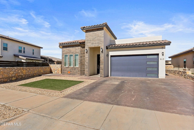 mediterranean / spanish house with a garage