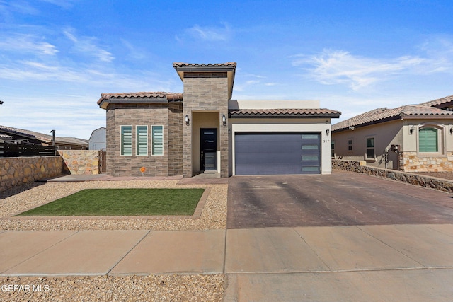 mediterranean / spanish house featuring a garage