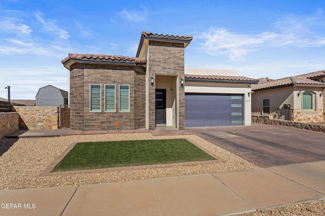 mediterranean / spanish home featuring a garage