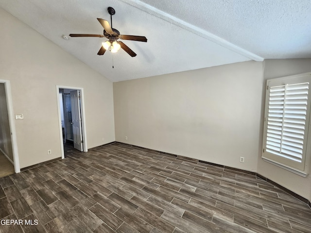 interior space with ceiling fan, lofted ceiling, and a textured ceiling