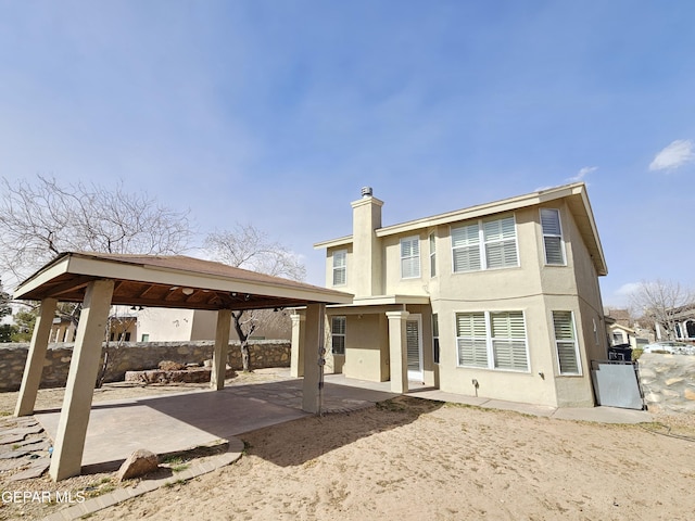 back of house featuring a gazebo and a patio area