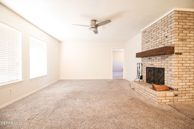 unfurnished living room featuring carpet floors, ceiling fan, and a fireplace