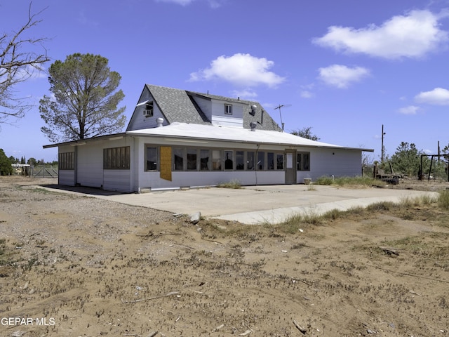 back of house with a patio area