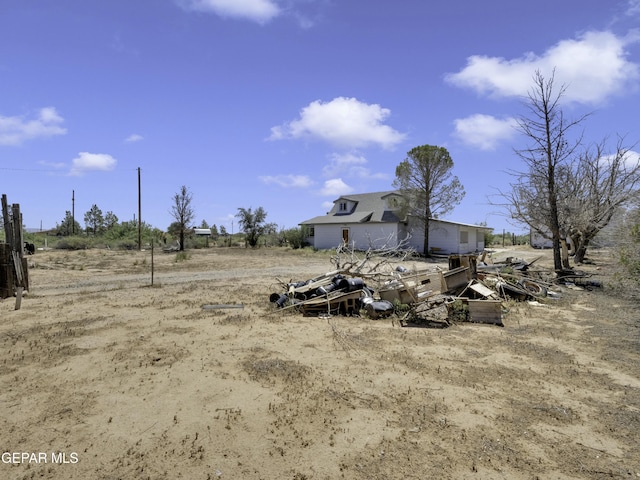 view of yard with a rural view