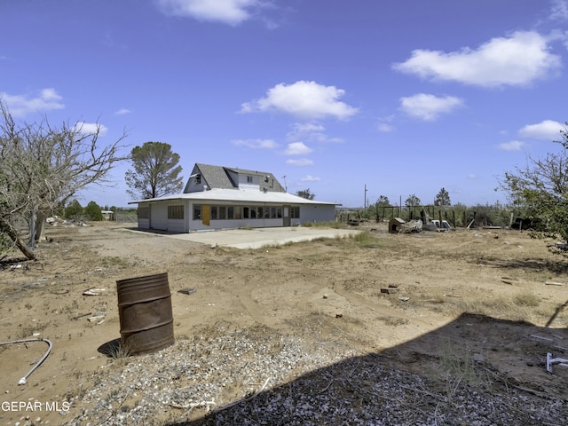 back of property featuring a patio