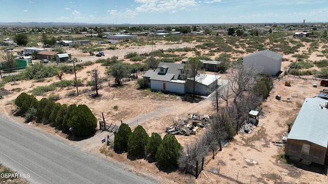 birds eye view of property featuring a rural view