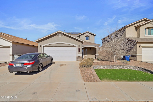 view of front of home featuring a garage and solar panels