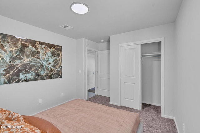 carpeted bedroom featuring a closet