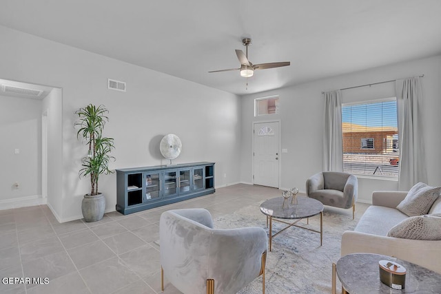 living room with light tile patterned floors and ceiling fan