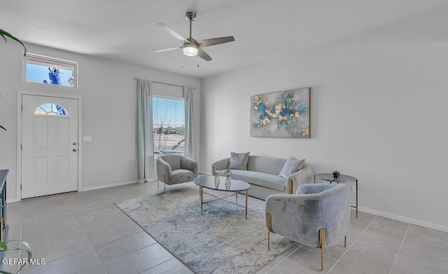 living room with light tile patterned floors and ceiling fan