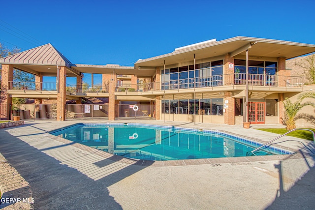 view of pool featuring a patio