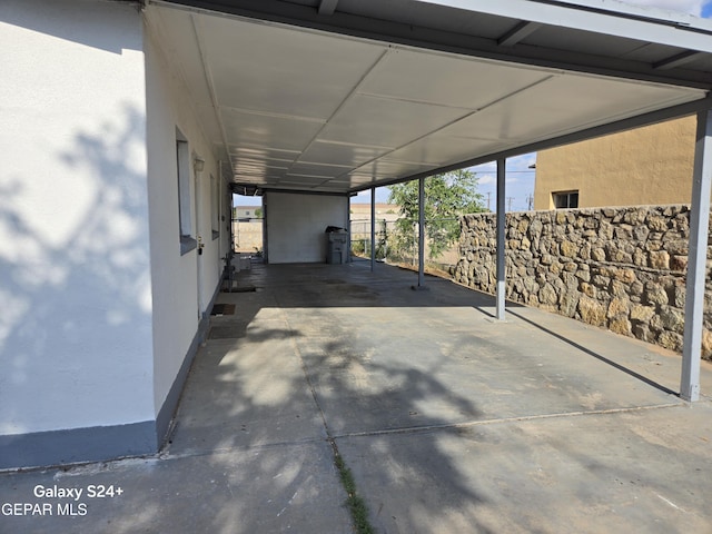 view of patio / terrace with a carport