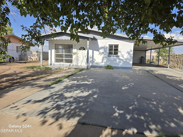 view of front of home featuring a carport