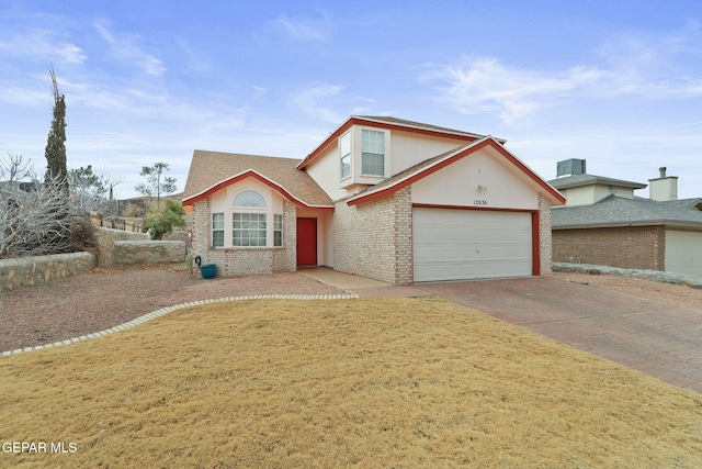 front facade featuring a garage and a front yard