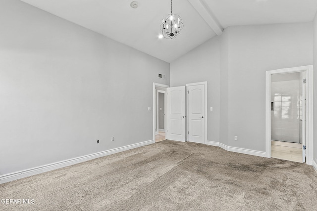 unfurnished bedroom with connected bathroom, high vaulted ceiling, beam ceiling, carpet, and an inviting chandelier