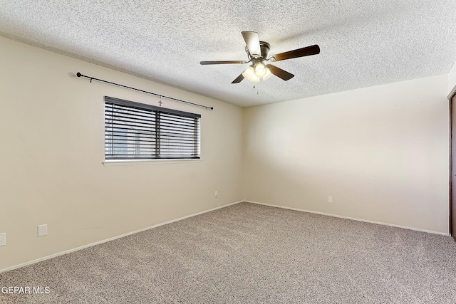 carpeted spare room featuring a textured ceiling and ceiling fan