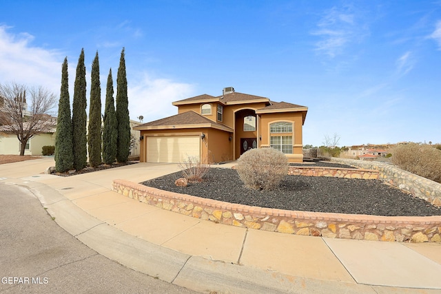 view of front of property with a garage