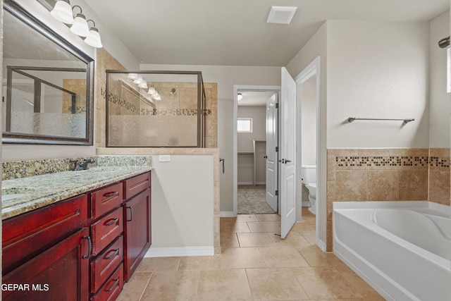 full bathroom with tile patterned floors, plus walk in shower, vanity, and toilet