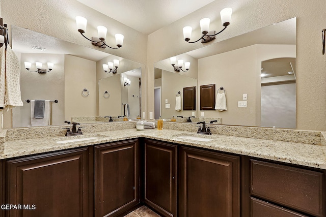 bathroom featuring vanity and a textured ceiling