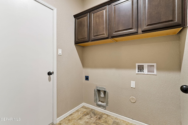 clothes washing area with cabinets, washer hookup, hookup for an electric dryer, and hookup for a gas dryer