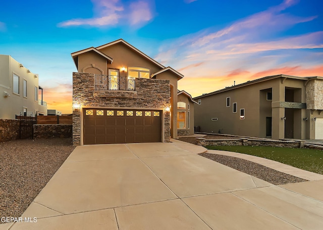 view of front property with a garage and a balcony