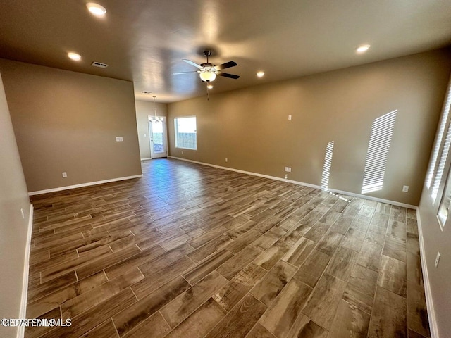 empty room featuring wood-type flooring and ceiling fan