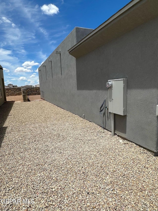 view of side of home with a patio area