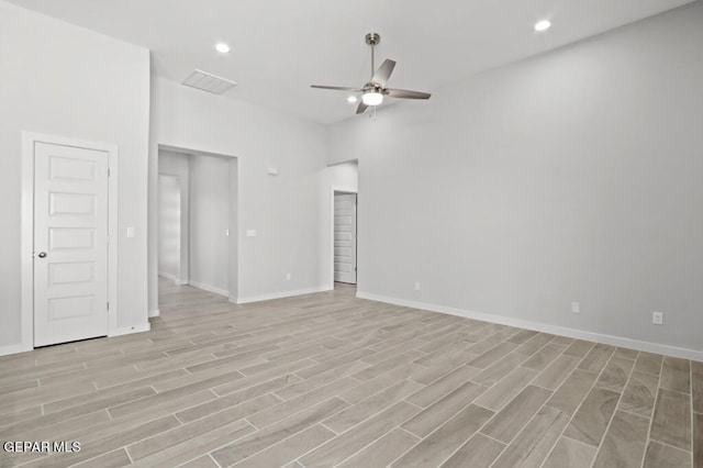 empty room with light hardwood / wood-style flooring and ceiling fan