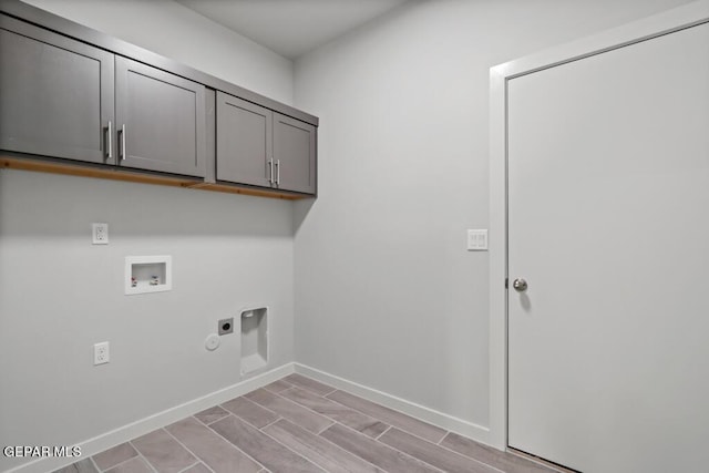 laundry area with washer hookup, cabinets, and hookup for an electric dryer