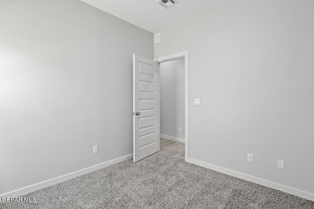 empty room featuring carpet flooring