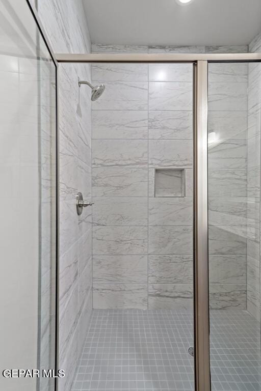 bathroom featuring an enclosed shower