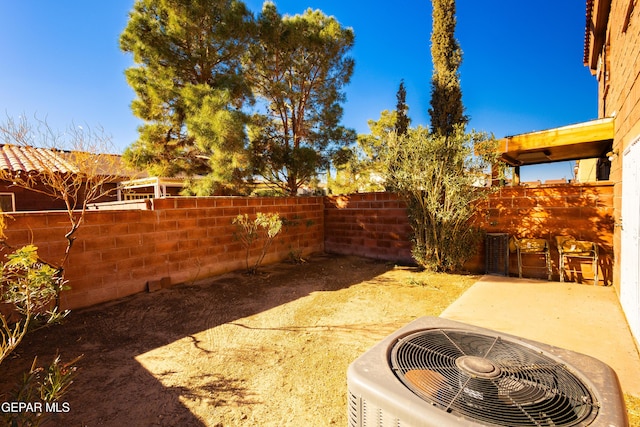 view of yard with a patio and central AC unit