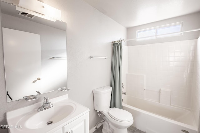 full bathroom featuring vanity, shower / tub combo with curtain, and toilet