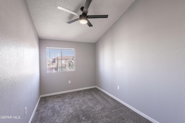 carpeted empty room with a textured ceiling and ceiling fan